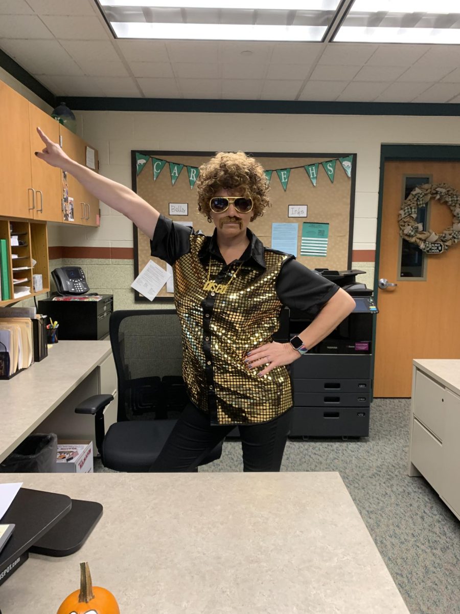 Ms. Rarick, administrative assistant to Dr. Buffington, is getting groovy on 70's day!