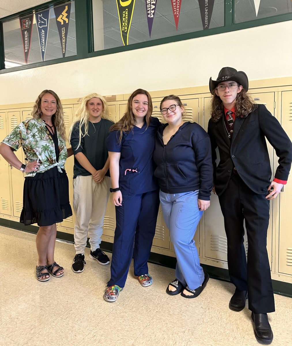 (Left to Right) Mrs. Disbrow, Gavin Russell, Emma Hall, Almira Jusufovic, George Aitchison pose for together for Periscope. From Mrs. Disbrows anticipated retirement to Emma and Almiras medical dreams to Georges business ambitions and Gavins luscious locks- theyre representing the versatility of the futures at CHS!