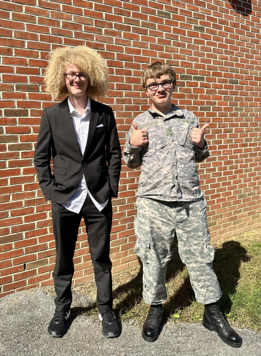 We Want You: Senior Jack Spears and Sophomore Timothy Gatrell are the upcoming faces of the U.S. with their combat boots and untucked dress shirts.