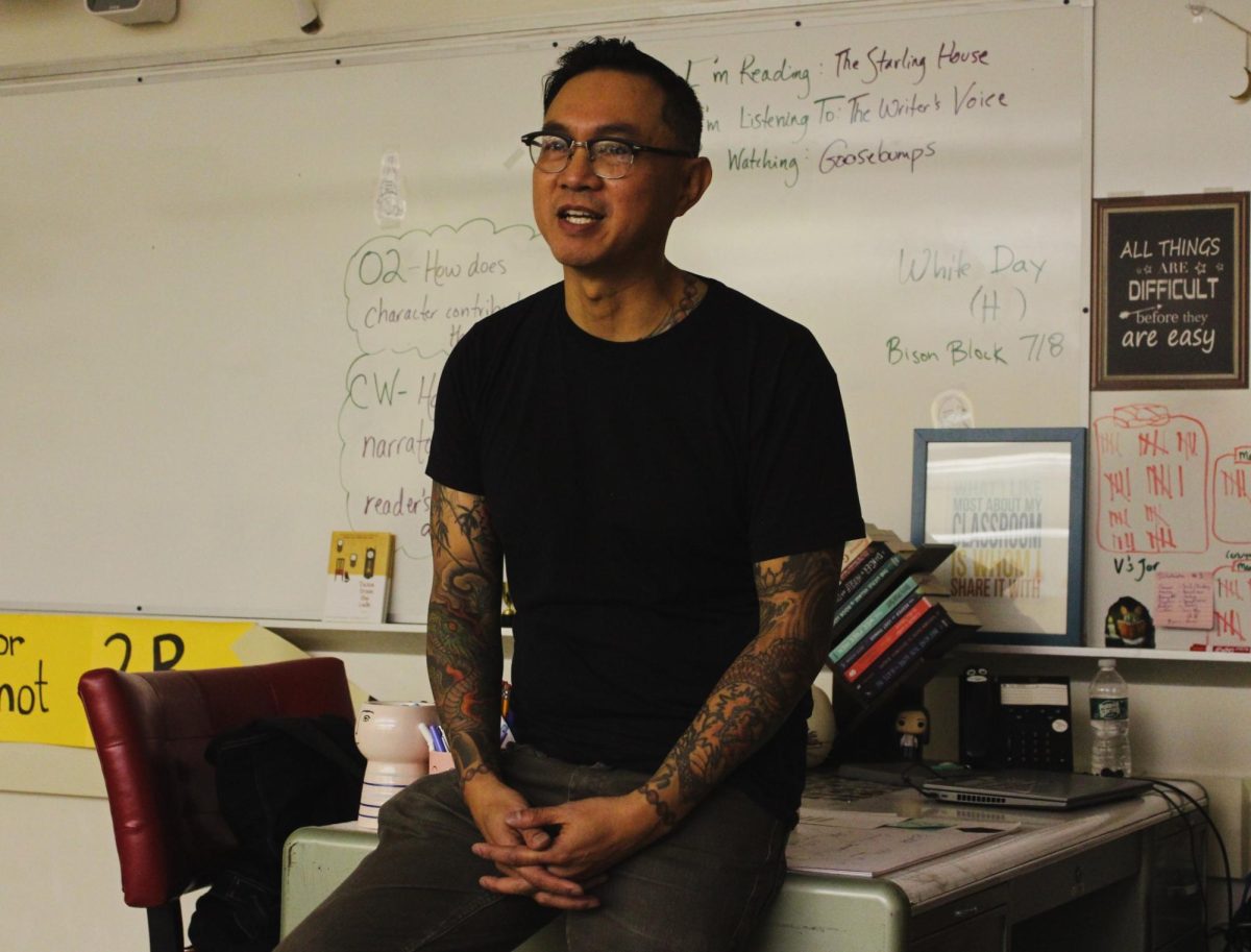 BACK TO THE FUTURE: Phuc Tran stands at the front of Ms. Clayvilles classroom discussing his involvement in Periscope in high school. This was the first time he had been back in the halls of CHS, decades later. 