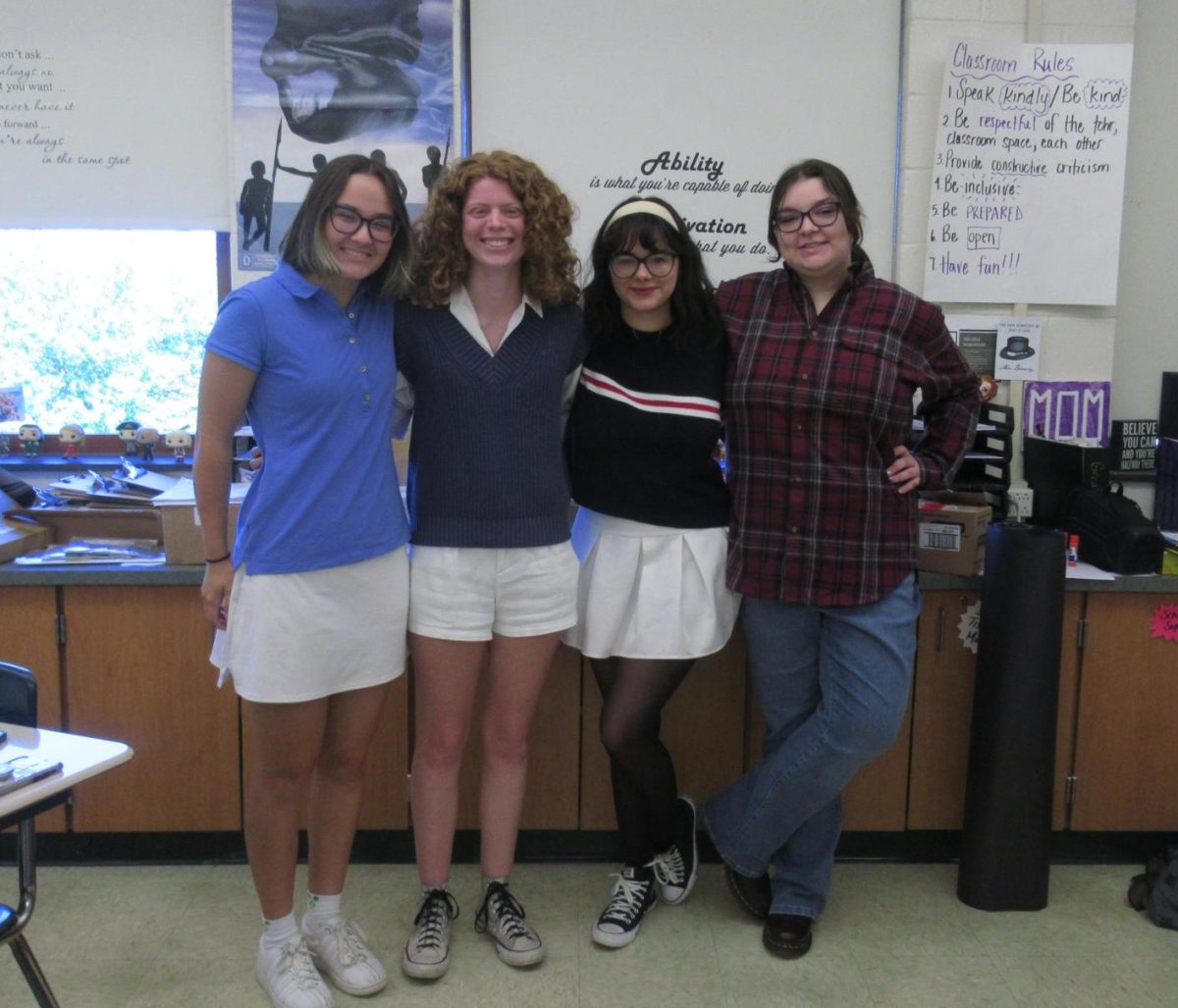 Oracle staff (left to right) Elena Rasmussen, Sophie Mohr, Odessa Cruz, and Lillie Myers come together for a photo despite the country vs country club differences.