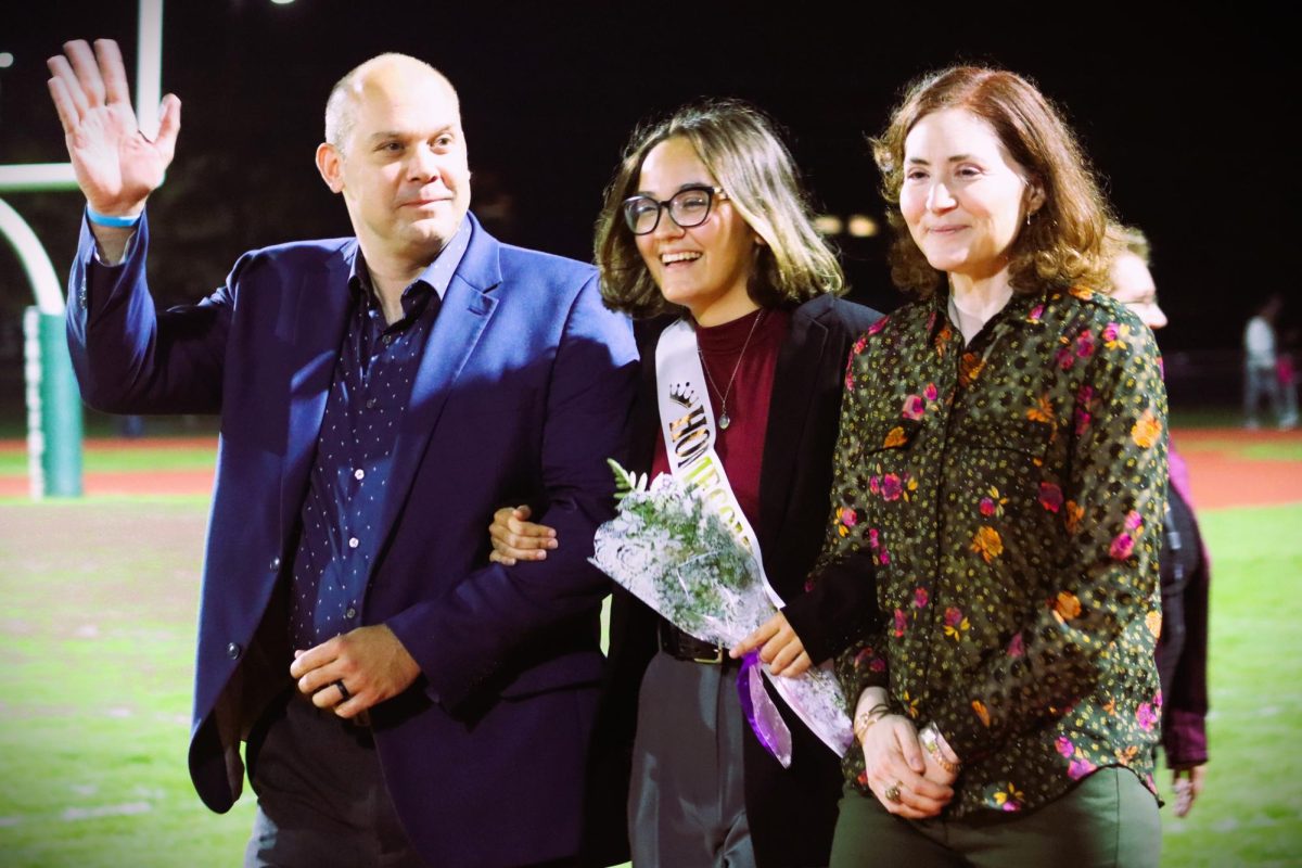 Elena Rasmussen escorted by her parents.