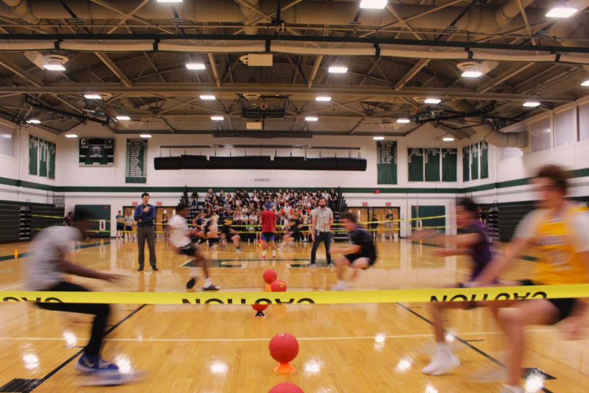 ROUND ONE BEGIN: The first few teams sprint toward the center line to grab their first round of ammo.  