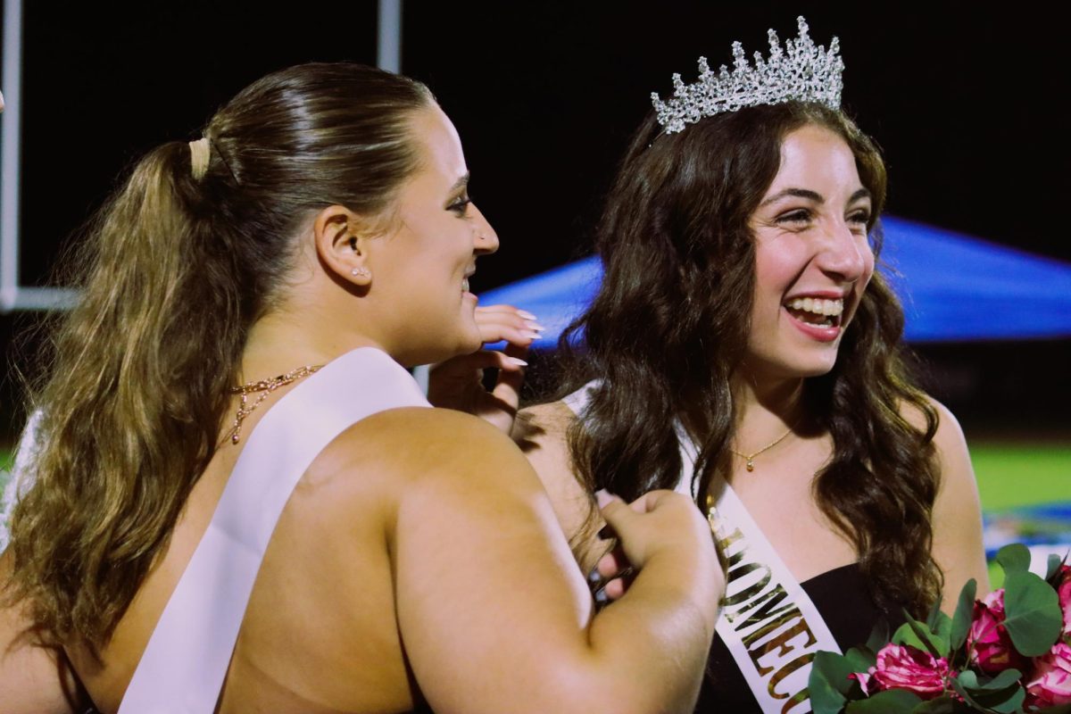 SPORTSMANSHIP: Fellow court nominee Jillian Witman congratulates Maia on her win.