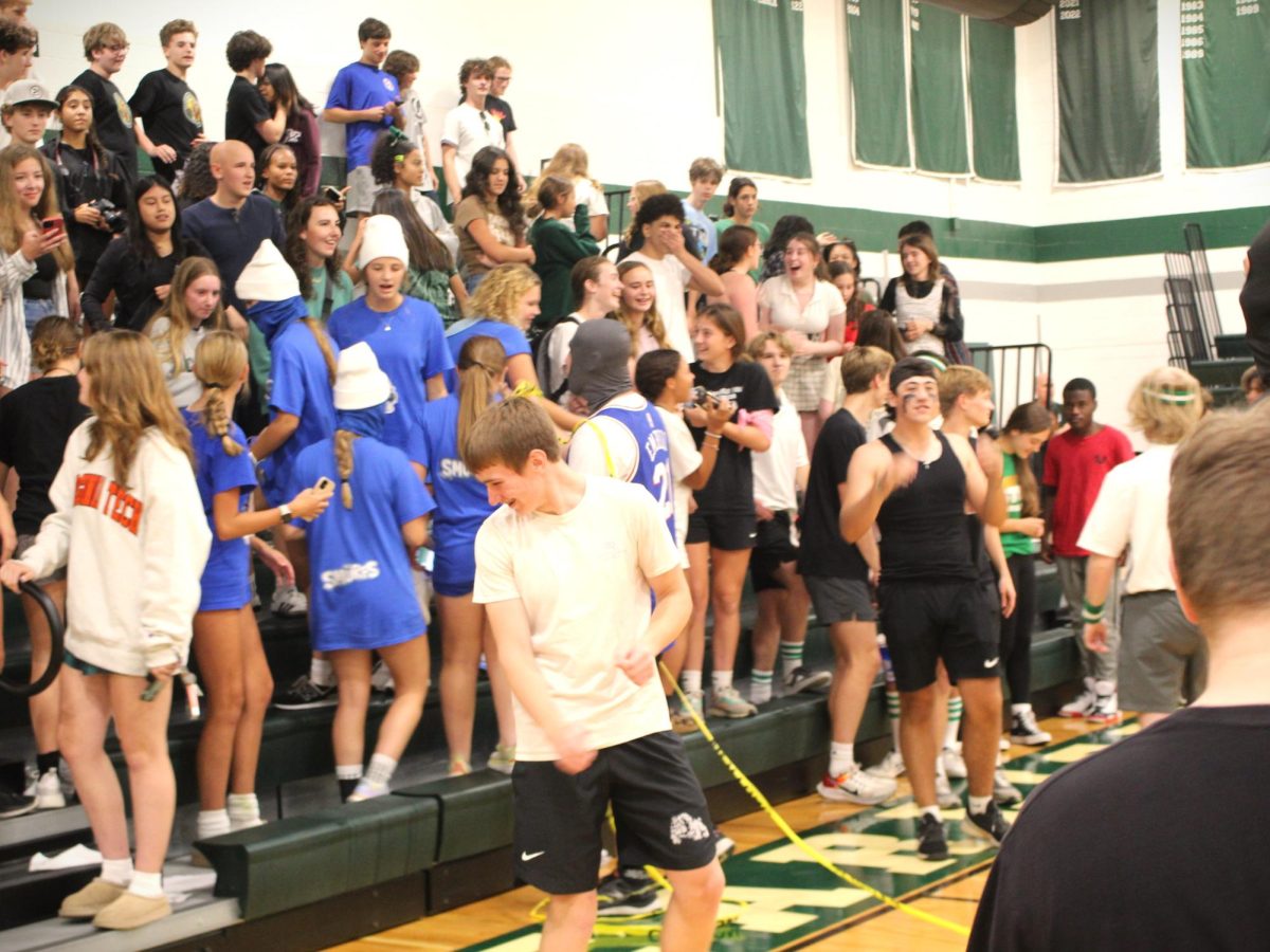 The crowd composing themselves to watch the grand finale after storming the court.