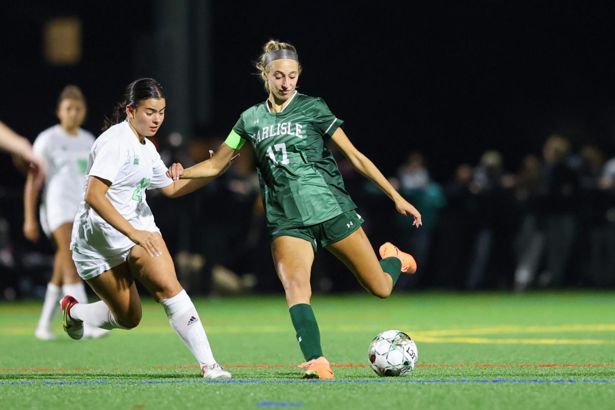 IN FOCUS: Addysen Fitzgerald shows no mercy to the opposing player as she passes the ball.