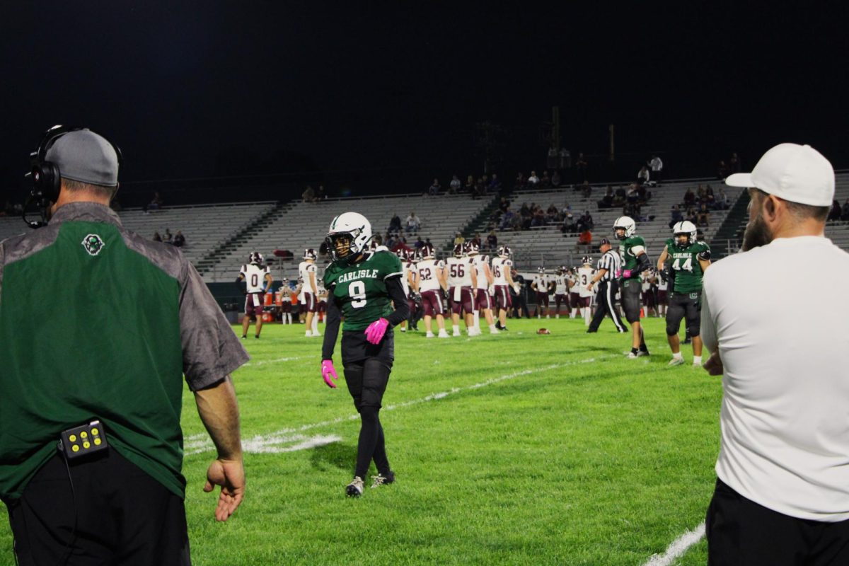 YES COACH: Carlisle coaches plan the Thundering Herd's next move against State College.