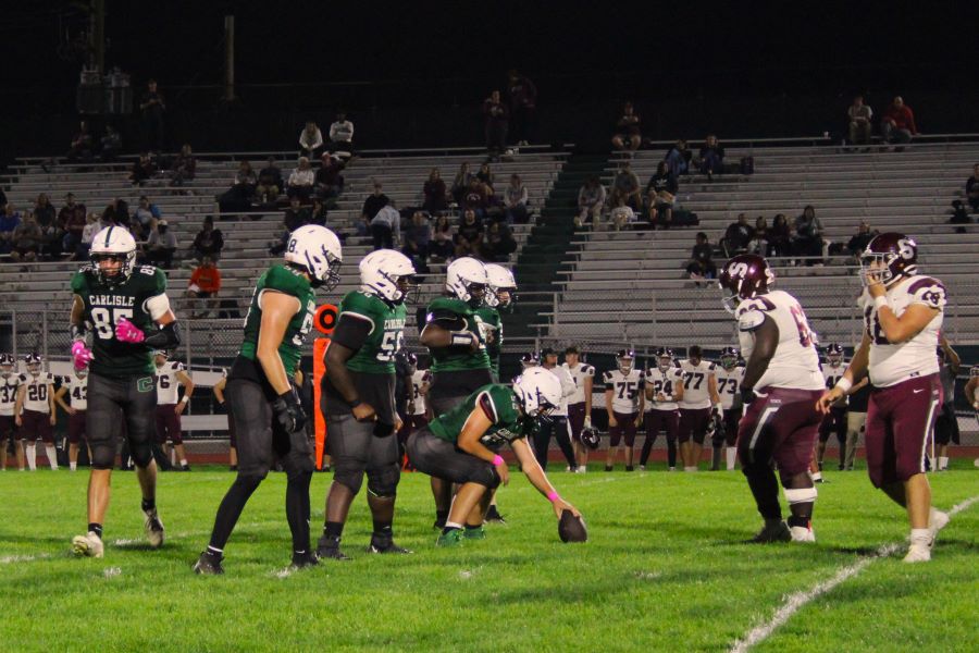 SET HIKE: The Carlisle football team prepares to snap the ball on Friday, October 7 against State College. 