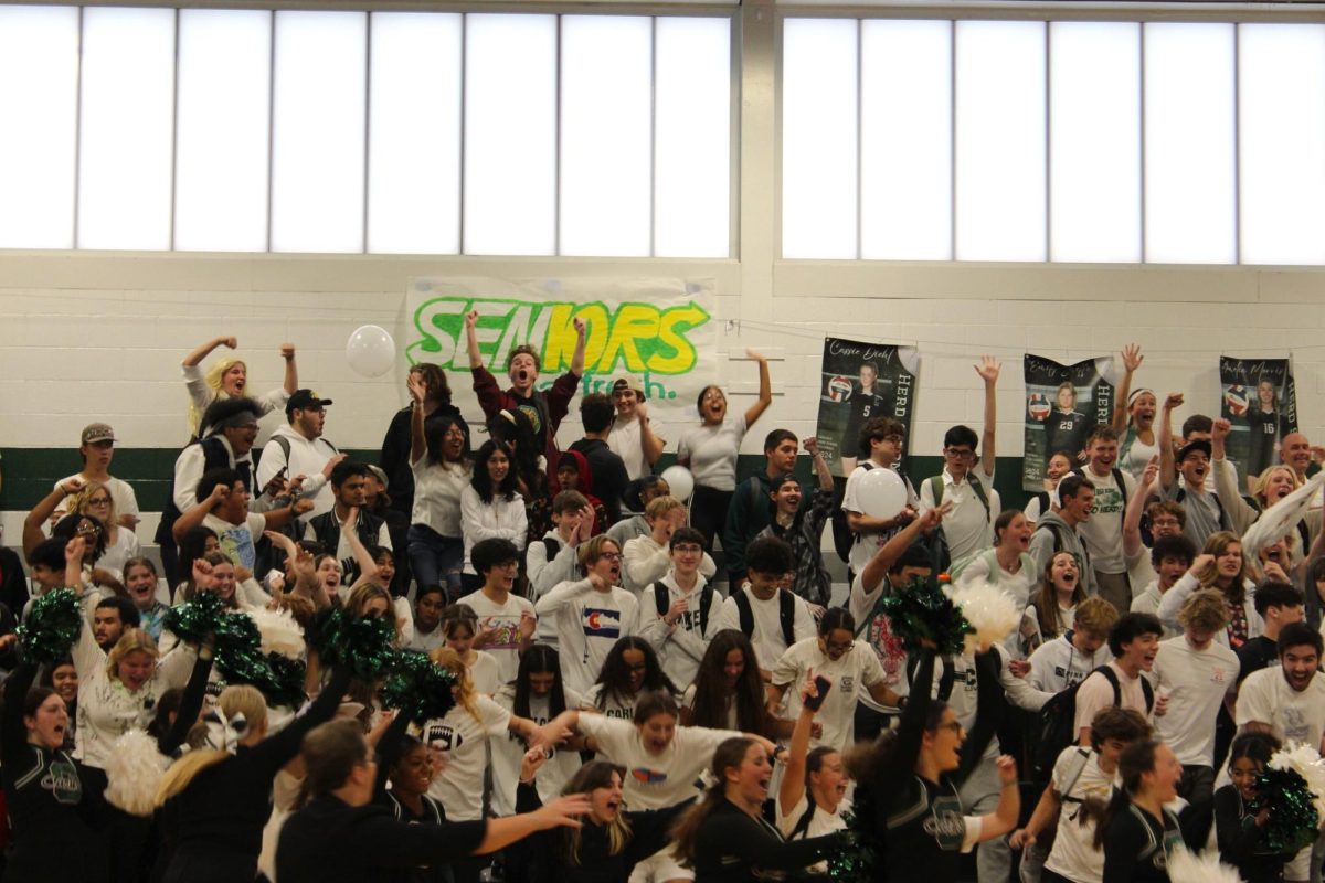 UNDEFEATED: The Senior class celebrates their Class Clash win by storming the basketball court. They took the title back this year after the Freshmen won last year, breaking the Senior's decade long reign.