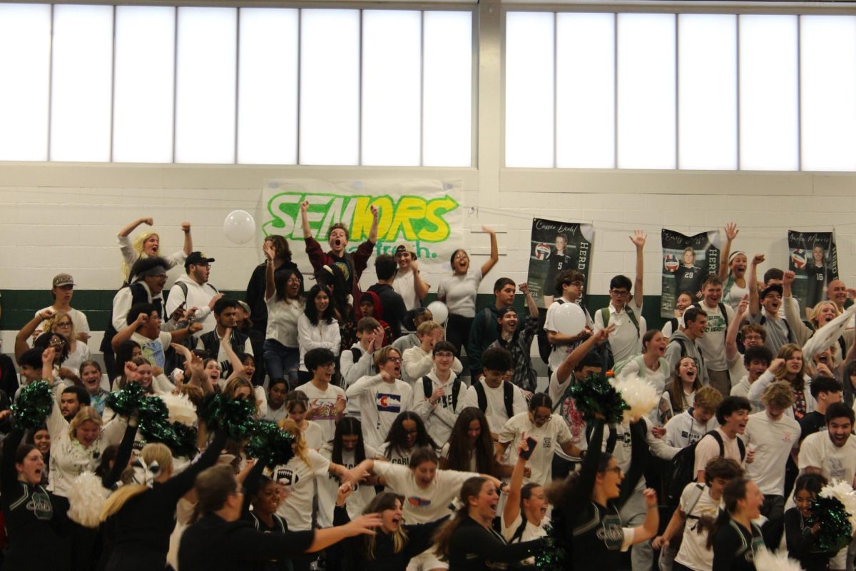 UNDEFEATED: The Senior class celebrates their Class Clash win by storming the basketball court. They took the title back this year after the Freshmen won last year, breaking the Seniors decade long reign.