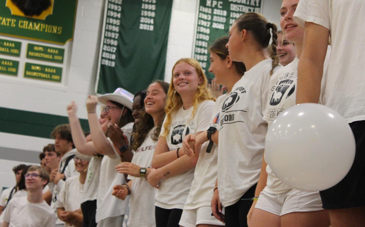 CLASS OF 2024: The front row of Seniors look on at the Pep-Rally festivities with excitement, supporting their fellow classmates.