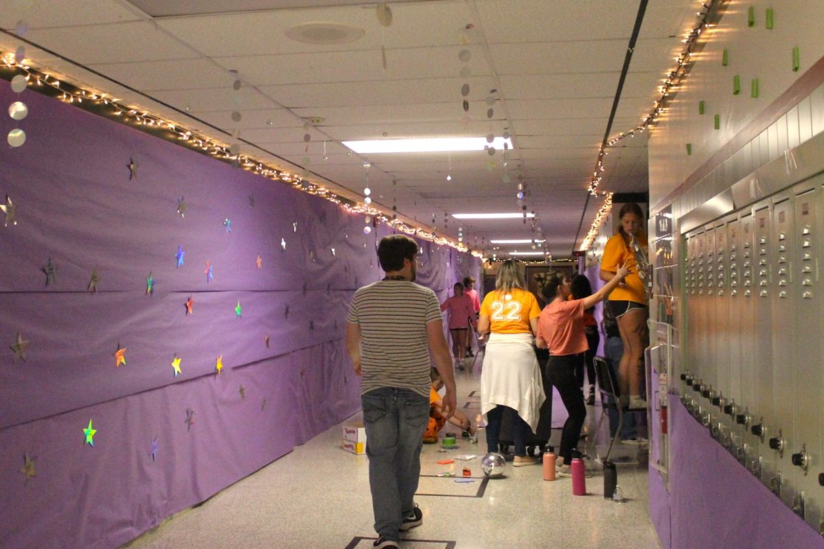 SENIOR STARS: The Sophomore Class Council works hard to bring together their designated hallway adorned with silver stars displaying the names of the senior class.