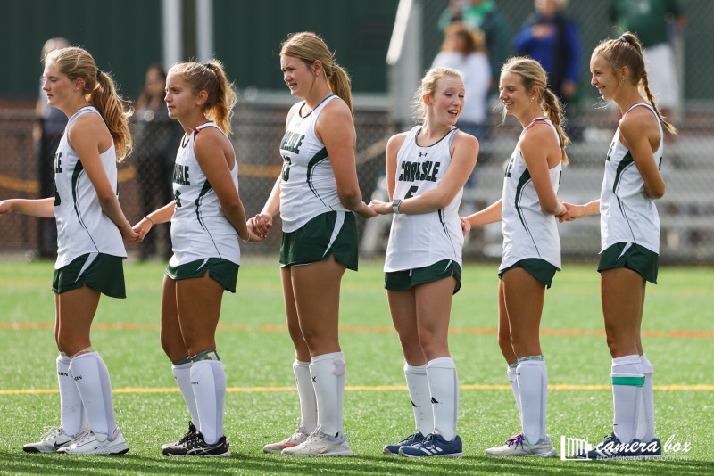 SPORTSMANSHIP: Girls varsity field hockey players support each other before their game begins.