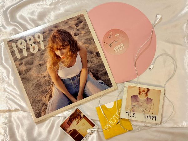 OUT WITH THE OLD IN WITH THE NEW: The original CD version of 1989 lies next to the Rose Garden Pink Vinyl edition of 1989 (Taylors Version). This version of the vinyl was exclusively available on Swifts website for a limited time prior to the records release.