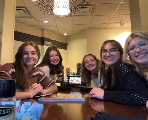 PASTA PARTY: Pictured from left to right is Hannah Stoner, Elisabeth Forrester, Lyric Koch, Jillian Grimes, and Myana Brown. They sit ready to dive into their first bowls of pasta. 