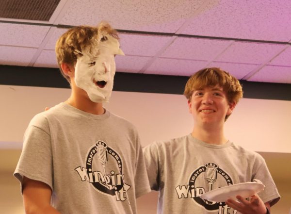 Junior Logan Forbes (left) being pied in the face by junior Colin Ingraham (right) 
