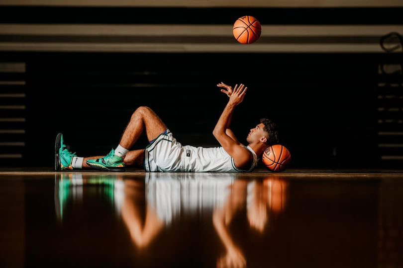 Jaydon+Smith+flicks+a+ball+in+the+air+on+the+Carlisle+court.+