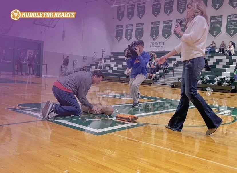 Huddle for Hearts: This event was held at Trinity High School where they donated 4 AEDs to 3 local businesses, including the Harrisburg Area YMCA, Panthers Select Softball and 717 Athletics. This photo was taken of Bill Odoms, the foundations CPR instructor, and Julie Walker giving an instructional CPR lesson to Trinity students.    