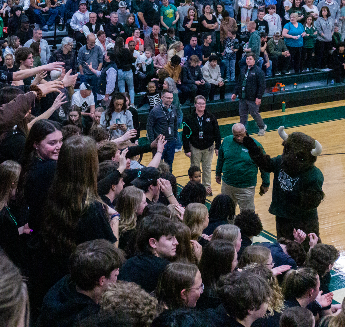 The Bison tosses necklaces to fans in the crowd.