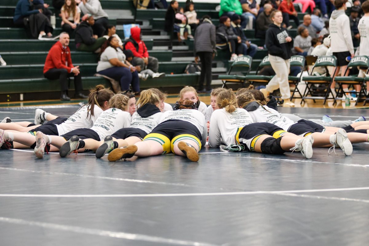 The Lady Herd gather before their meet.