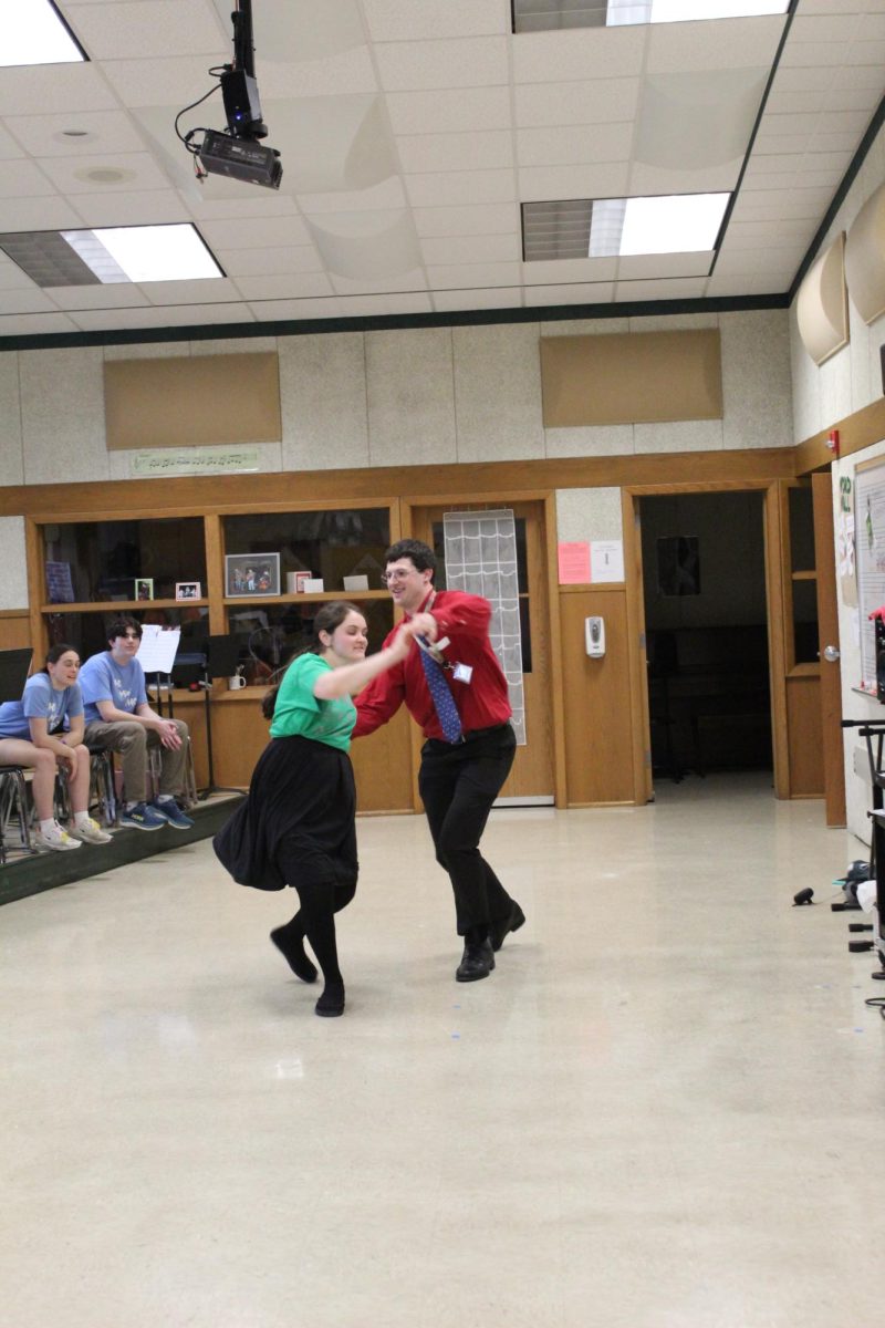 Ms. Wenger and Mr. Parker teaching students various dances