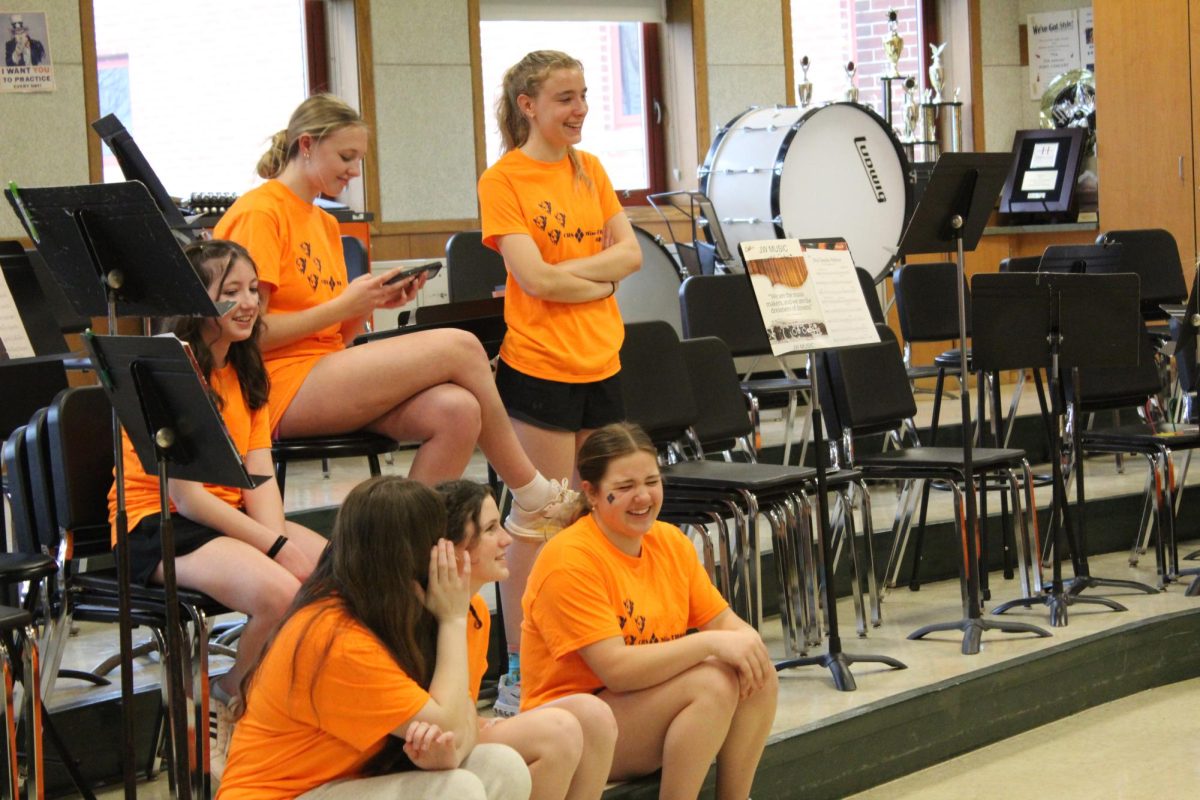 Students observe while Ms. Wenger and Mr. Parker teach classic dances 