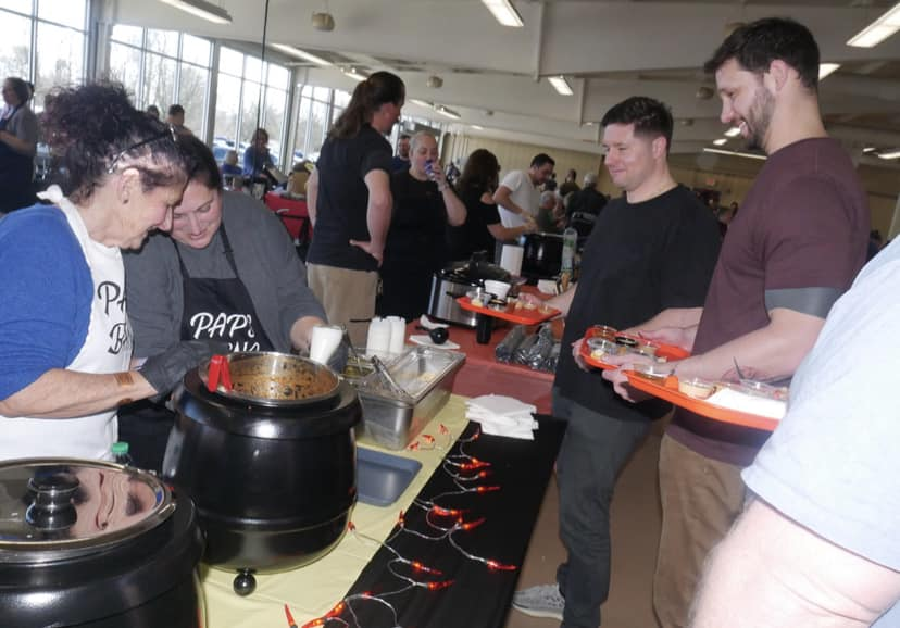 FOOD FOR THOUGHT: This is a photo taken at the Soup Cook Off of a team serving soup. All of the proceeds of this event went to charitable causes.