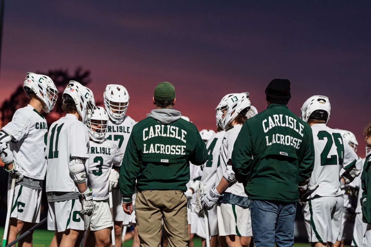 GAME READY: The Carlisle boys lacrosse team huddles before one of their games. 