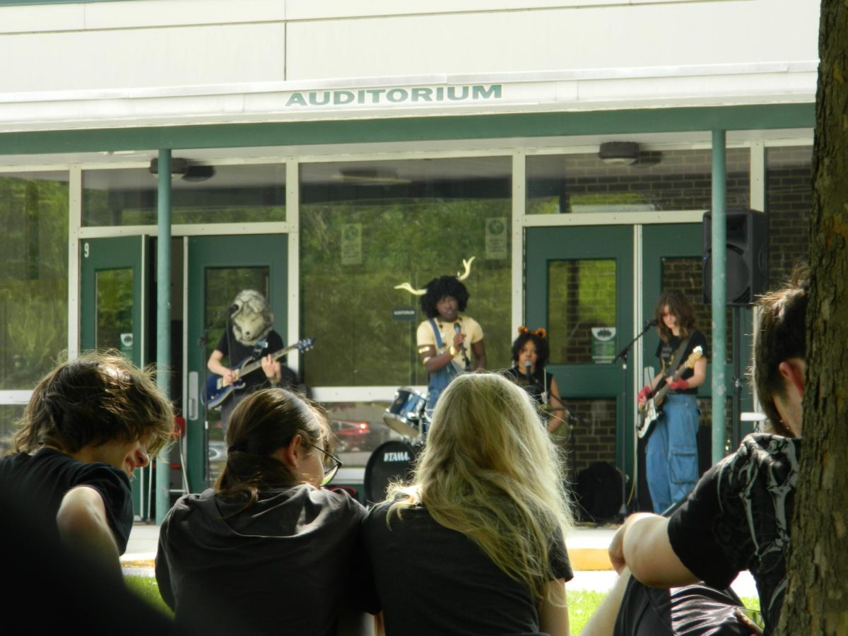 audience watching another band playing.