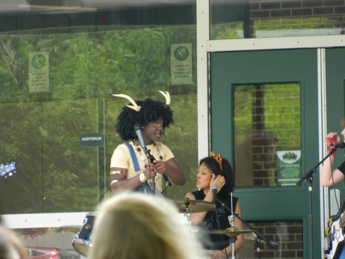Next band preps to sing.