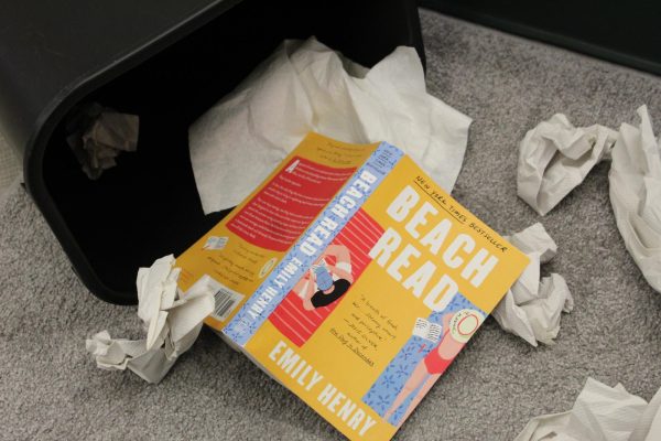 The "Beach Read" book being trashed due to its horrible plot.