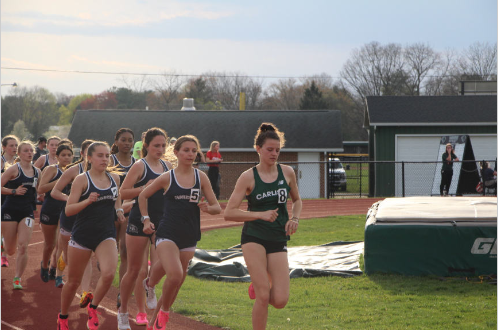 Emily leads the warm-up run in focus.