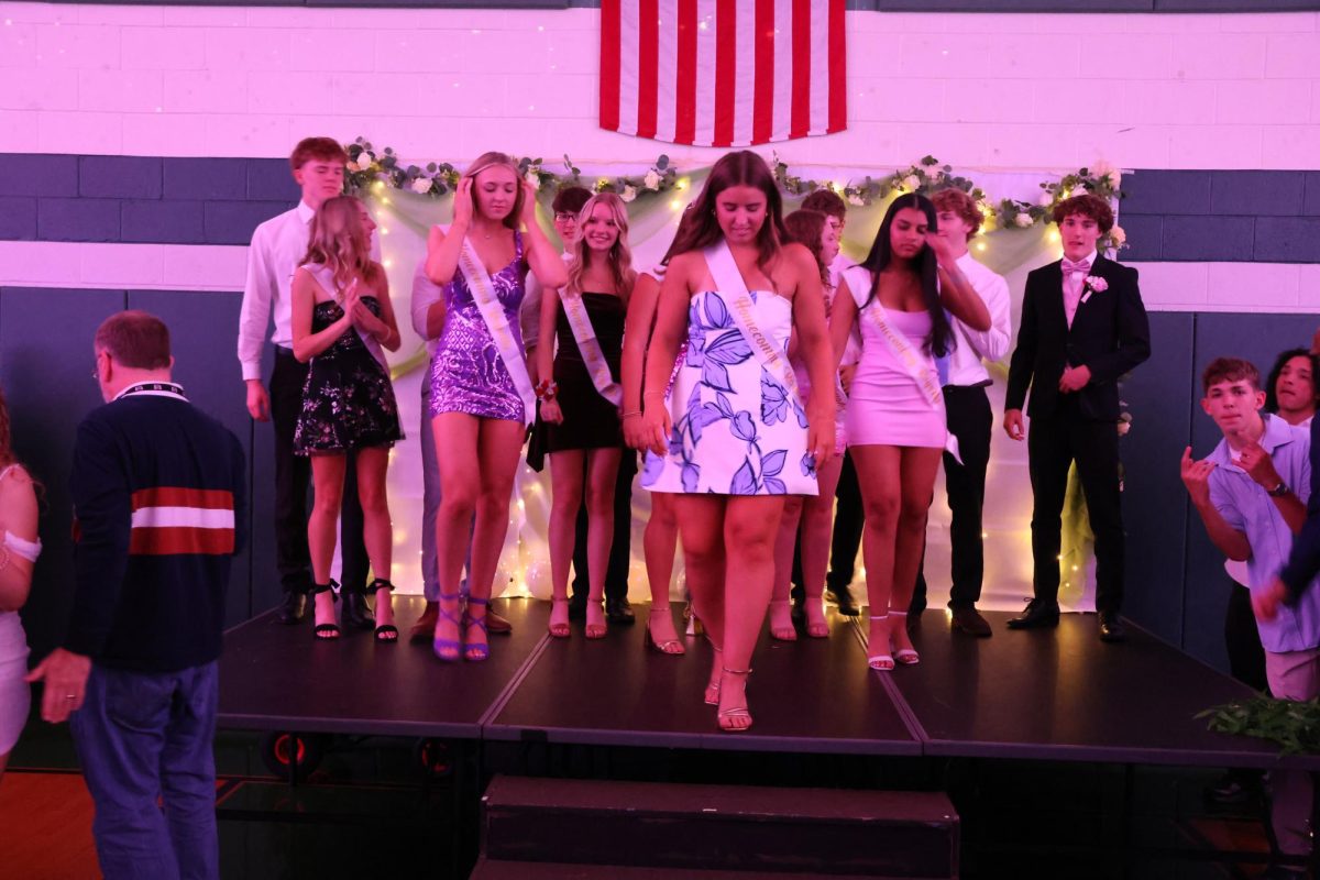 Hoco Court walking off the stage